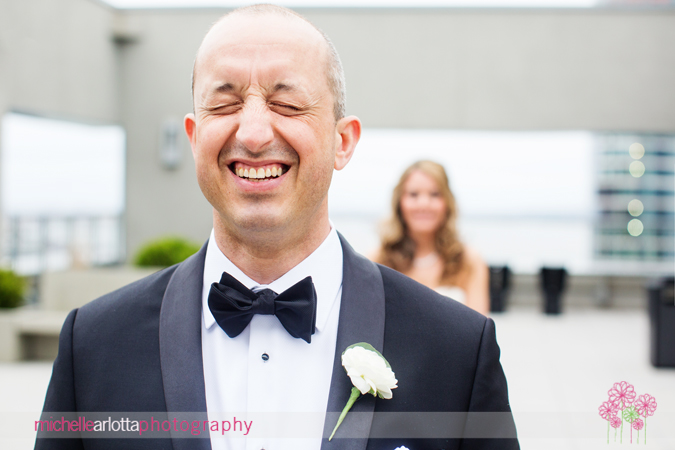 groom laughing before first look