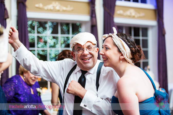 father of bride and sister of bride wearing napkins on their heads