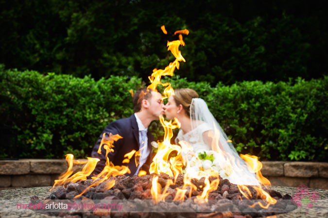 bride and groom kissing at fire pit landmark venues new jersey