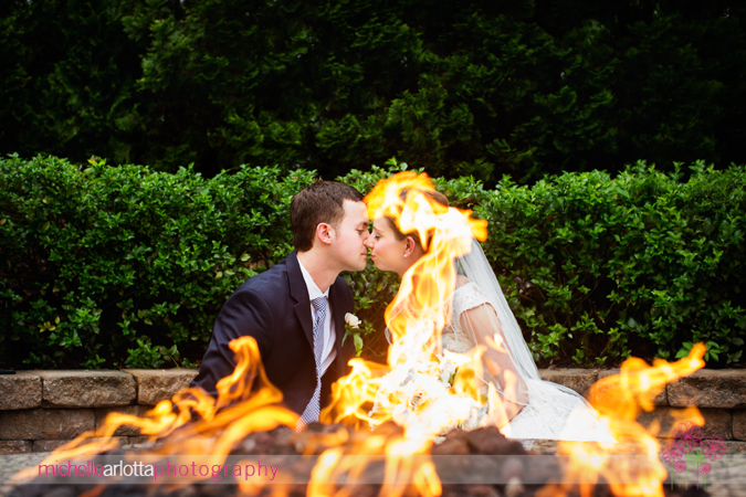 bride groom fire pit kiss