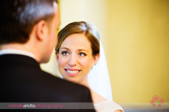 bride looking at groom during wedding ceremony