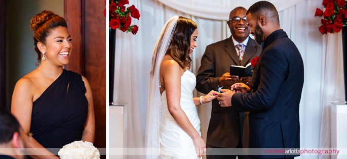 groom puts ring on bride during indoor wedding ceremony at Nassau Inn in Princeton, NJ photographed by michelle Arlotta photography