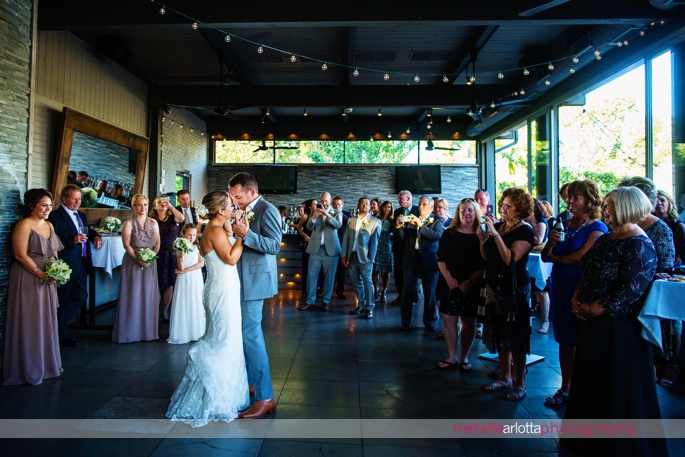 bride and groom first dance at treno pizza bar wedding