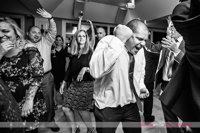 wedding guests dance during rock island lake club wedding reception