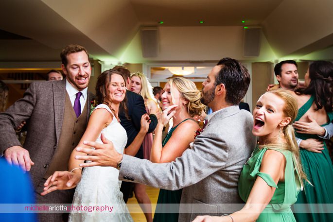 wedding guests dance during rock island lake club wedding reception