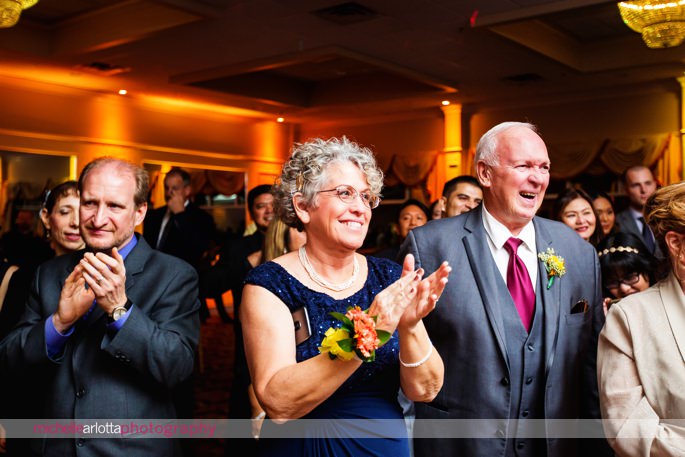 wedding guest clapping during reception