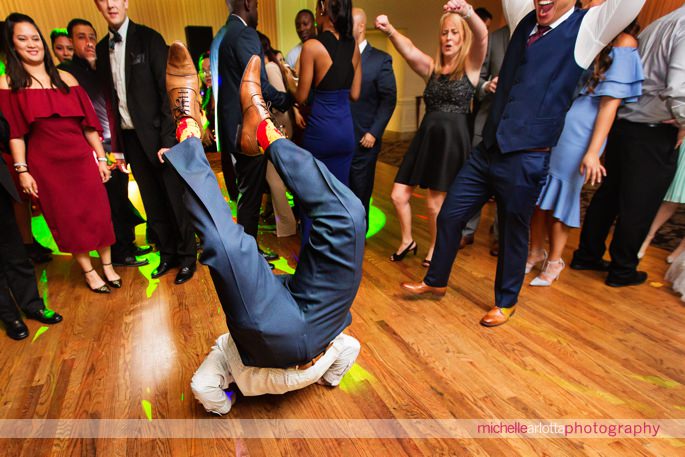 wedding guest does the worm at battleground country club photographed by michelle Arlotta photography