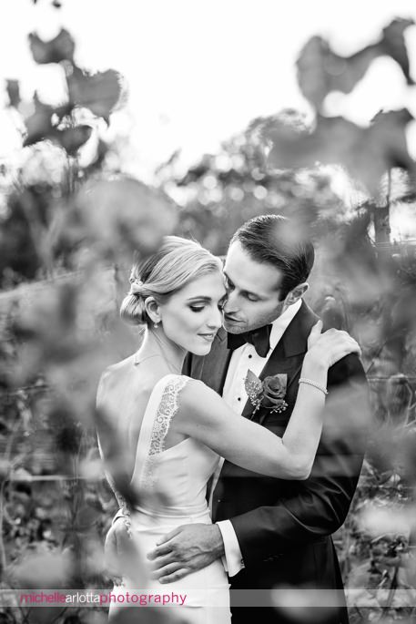 elegant bride in nicole miller NYC wedding gown and groom in tuxedo at brotherhood winery America's oldest winery wedding in washingontonville, ny by michelle Arlotta photography