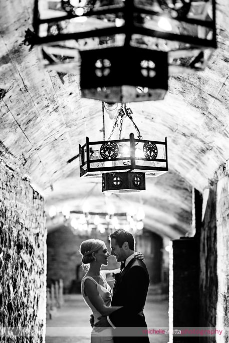 bride and groom in wine cellar at Hudson valley's brotherhood winery photographed by New Jersey wedding photographer michelle Arlotta
