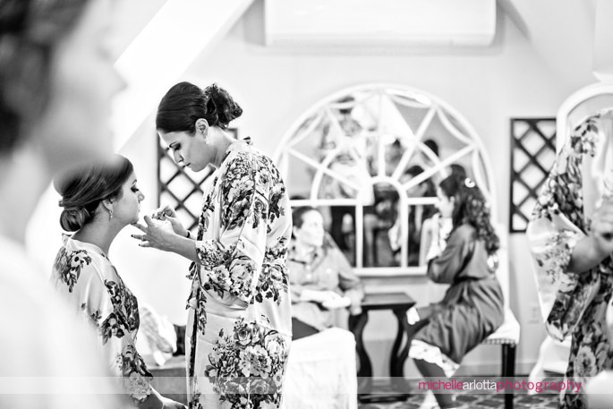 bridesmaids in floral robes get ready during fall New Jersey wedding