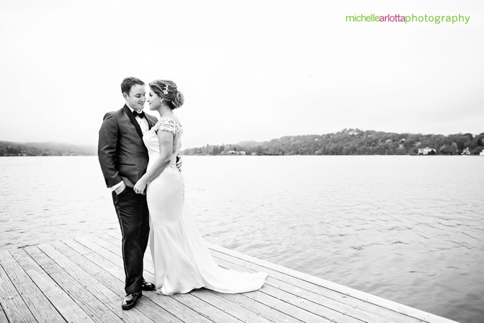 bride and groom on dock at lake mohawk nj