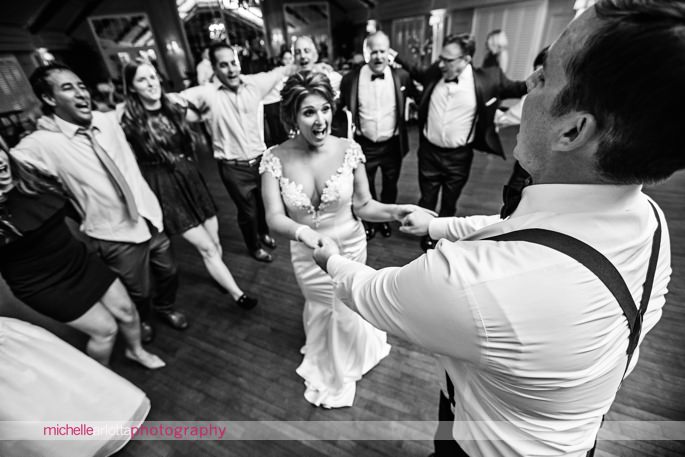 bride and groom dance together during lake mohawk country club wedding reception