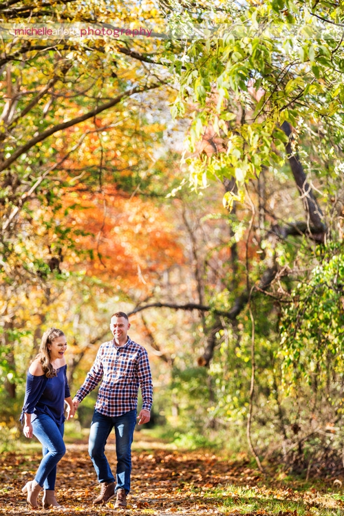 bear brook valley couple fall engagement session in Frenchtown New Jersey laughing together