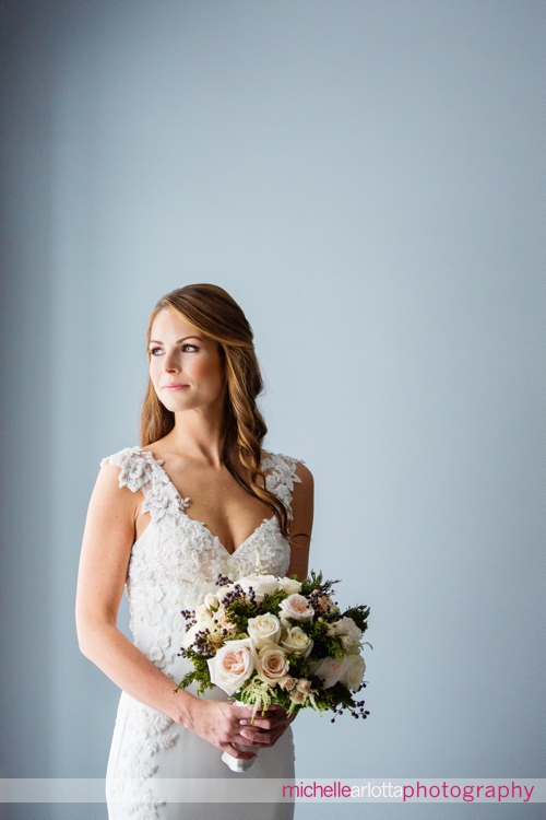 portrait of bride in chiarade wedding dress and winter bouquet by crest florist