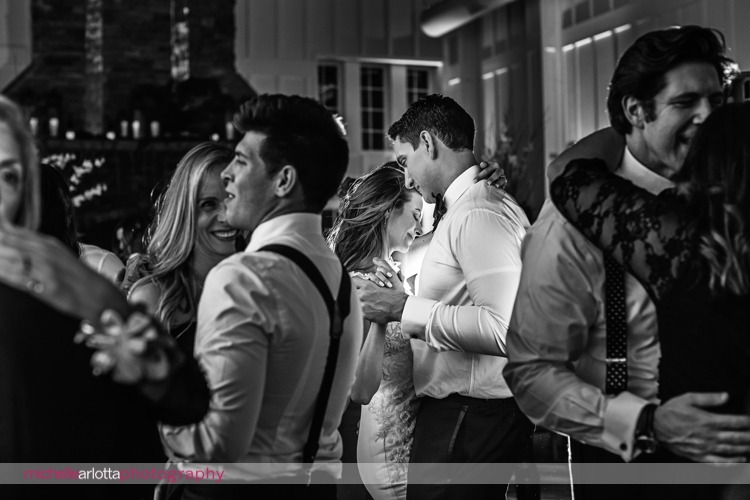 bride and groom slow dance among guests at Ryland inn coach house winter wedding