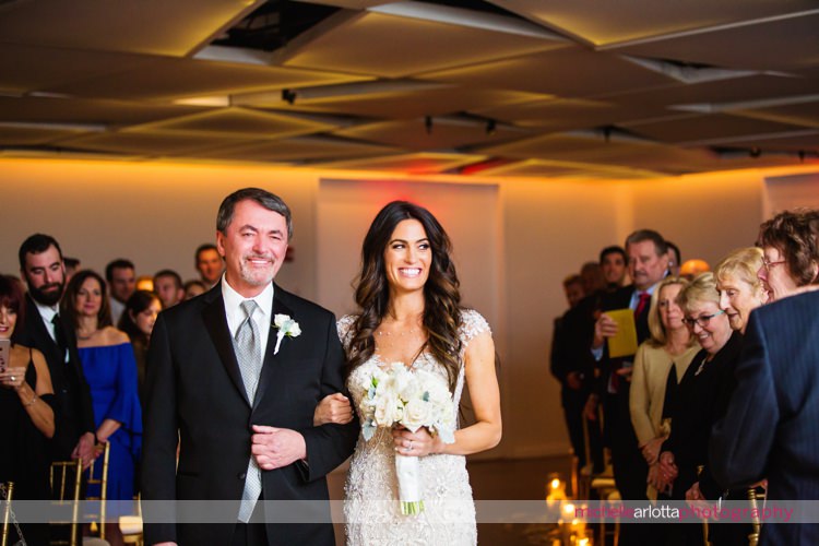 bride walks down the aisle with father at maritime Parc