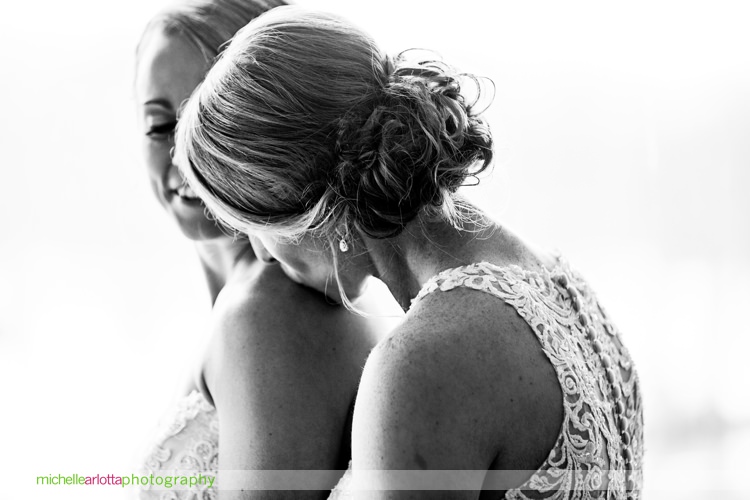 bride kisses other bride's shoulder during new jersey wedding