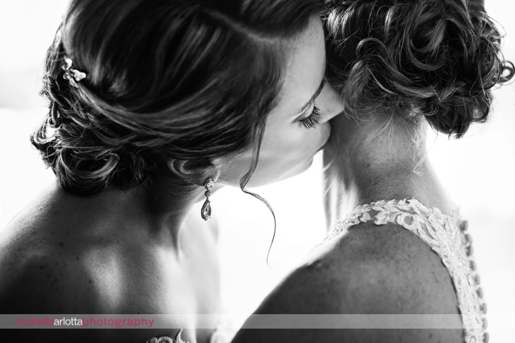 bride kisses bride's neck during sweet intimate candid moment at rock island lake club winter wedding with same sex nj wedding photographer Michelle arlotta photography