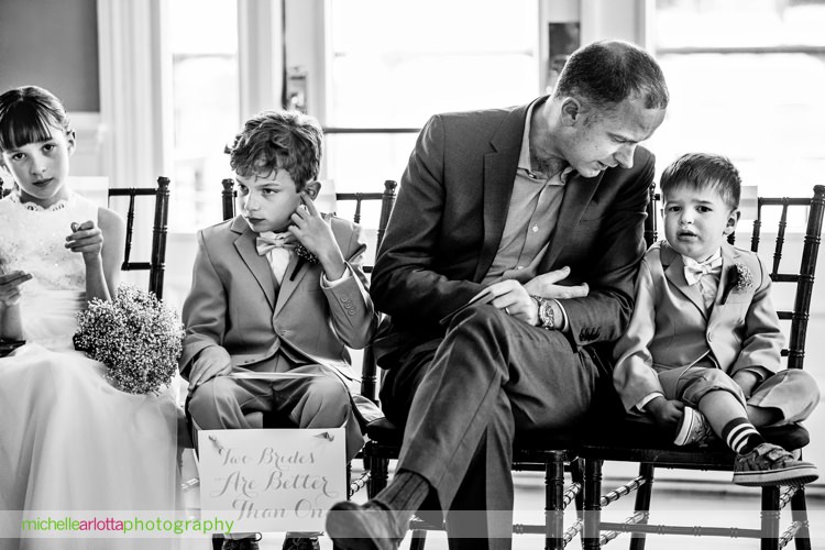 kids look bored and distracted during indoor wedding ceremony