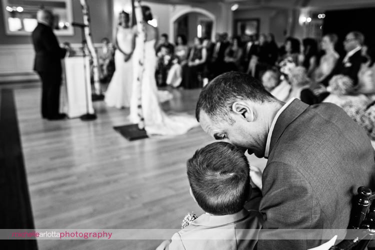 father leans into small son during same sex wedding ceremony in New Jersey