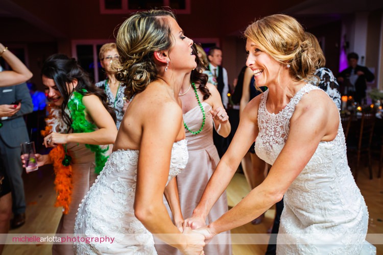 brides dance together during New Jersey same sex wedding reception