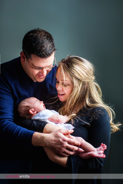 mother and father with newborn daughter