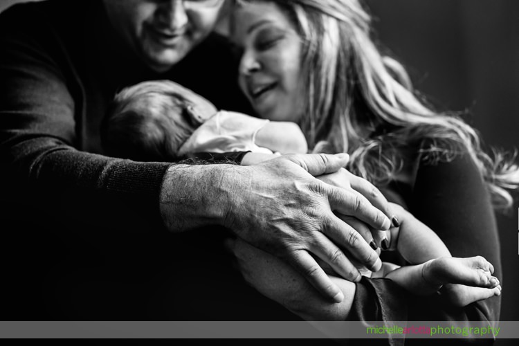 New Jersey family looks lovingly at newborn baby daughter