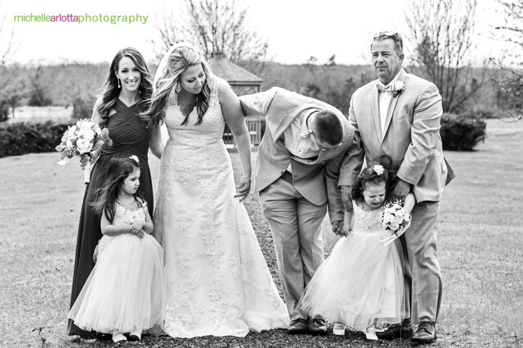 flower girls look sad during family photos in cherry valley country club New Jersey