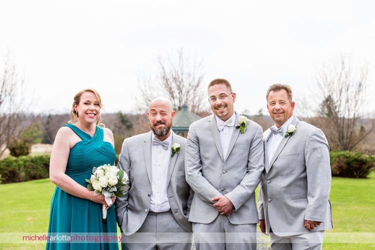 groom and sibling family portrait with one brother making funny face