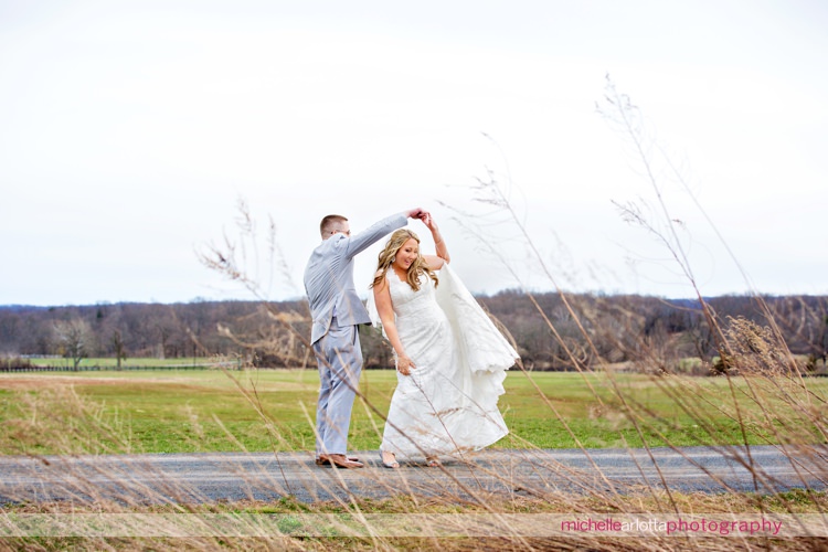 groom twirls bride around in New Jersey