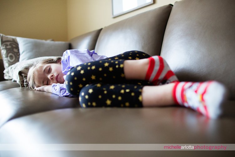 flower girl asleep on couch during bride prep