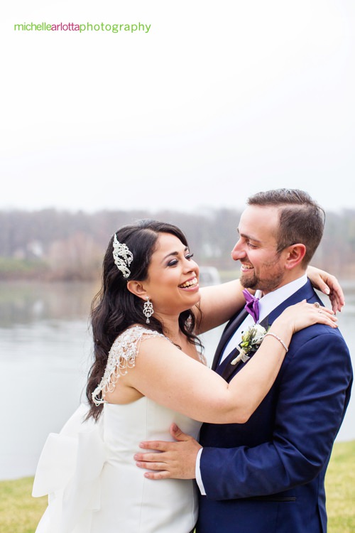 bride and groom laughing together during rock island lake club spring wedding portraits