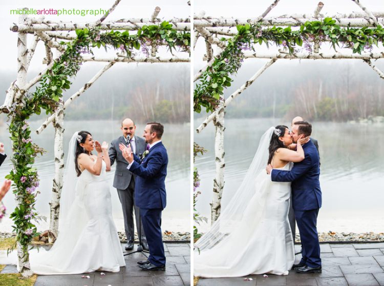 bride and groom kiss at the end of their rock island lake club outdoor wedding ceremony
