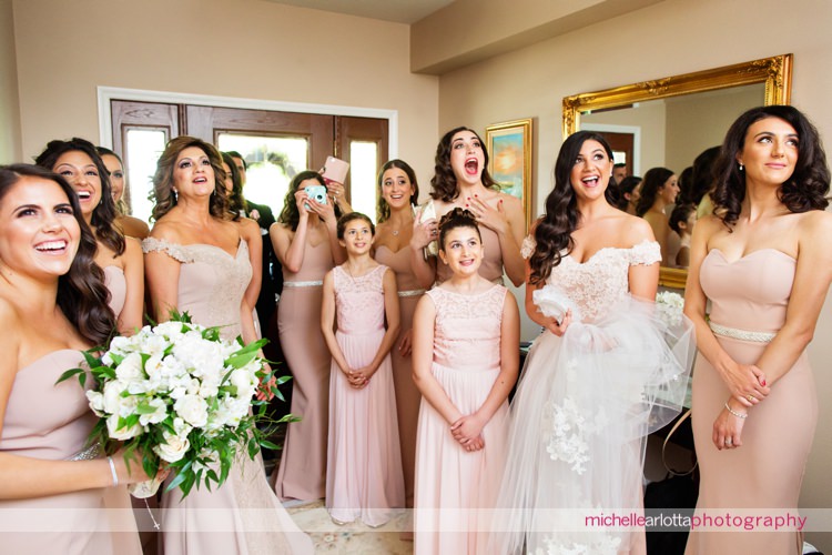 bridesmaids reaction to seeing bride all dressed up
