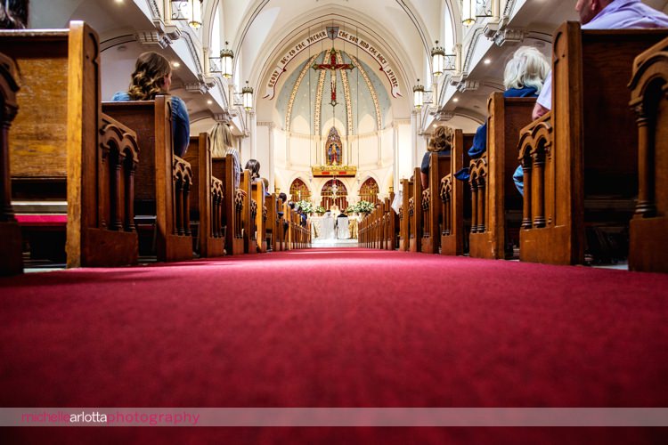wide shot of bride and groom at altar at sacred heart church on staten island