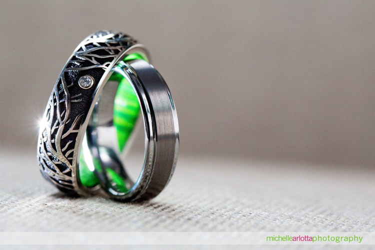 two grooms wedding ring with green inside detail