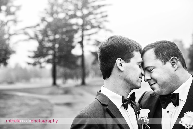 two grooms forehead to forehead at nj wedding