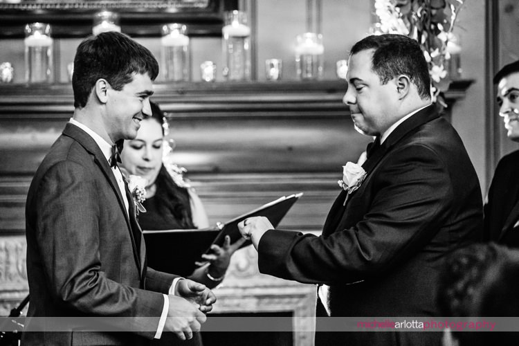 groom checks out his wedding ring during rockaway river country club nj same sex wedding ceremony