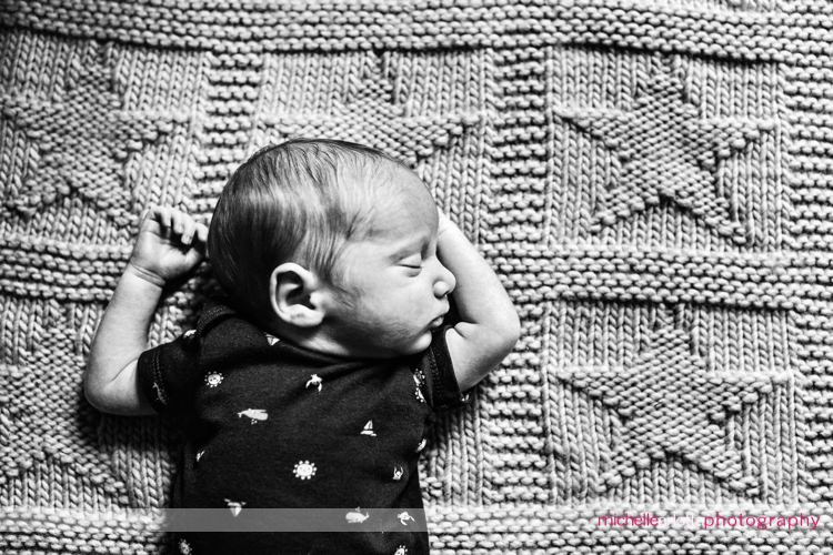 premie newborn sleeps on blanket