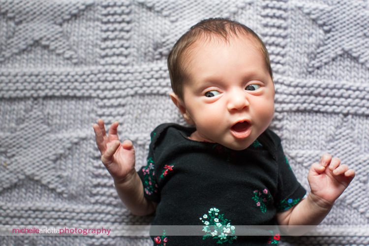 premie newborn makes faces for the camera
