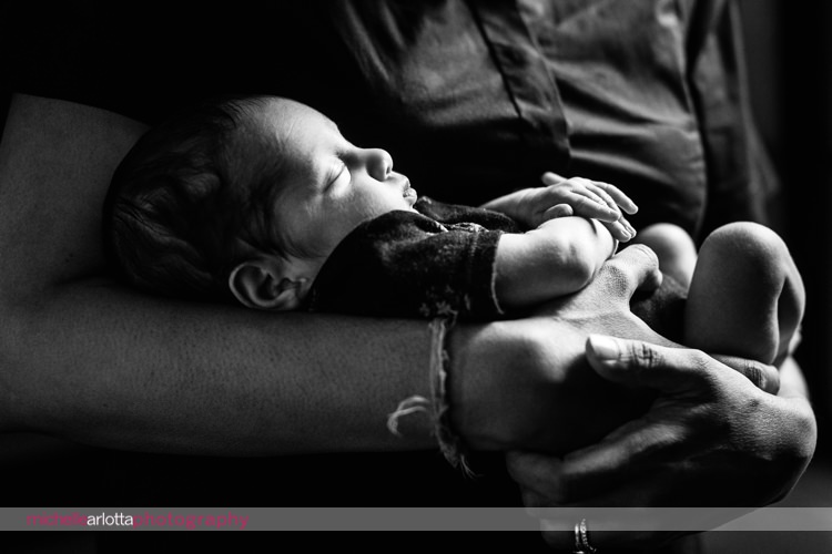 newborn premie asleep in mother's arms in New Jersey