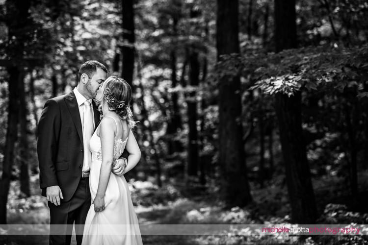 bride and groom in the forest at rock island lake club