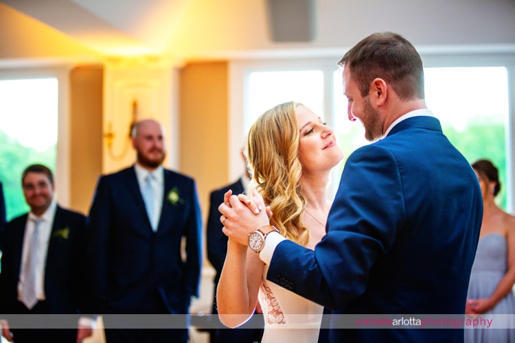 bride and groom share their first dance during super chill rock island lake club wedding