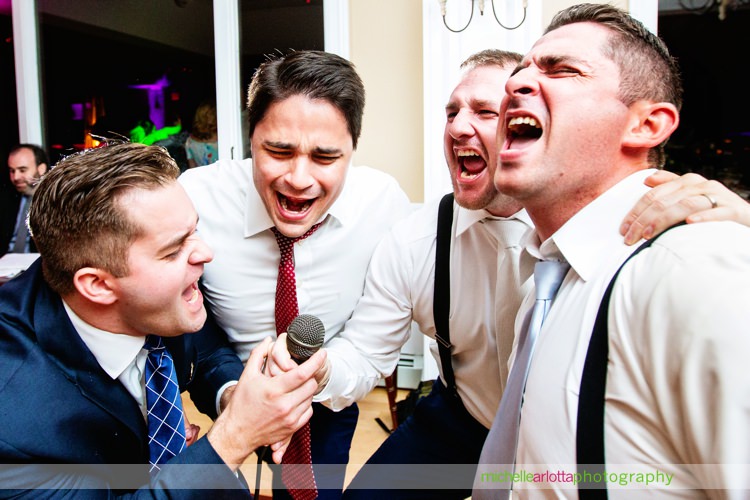grooms and friends sing Backstreet Boys song during nj wedding reception