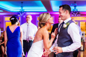 bride and groom laughing at each other on dance floor at bear brook valley