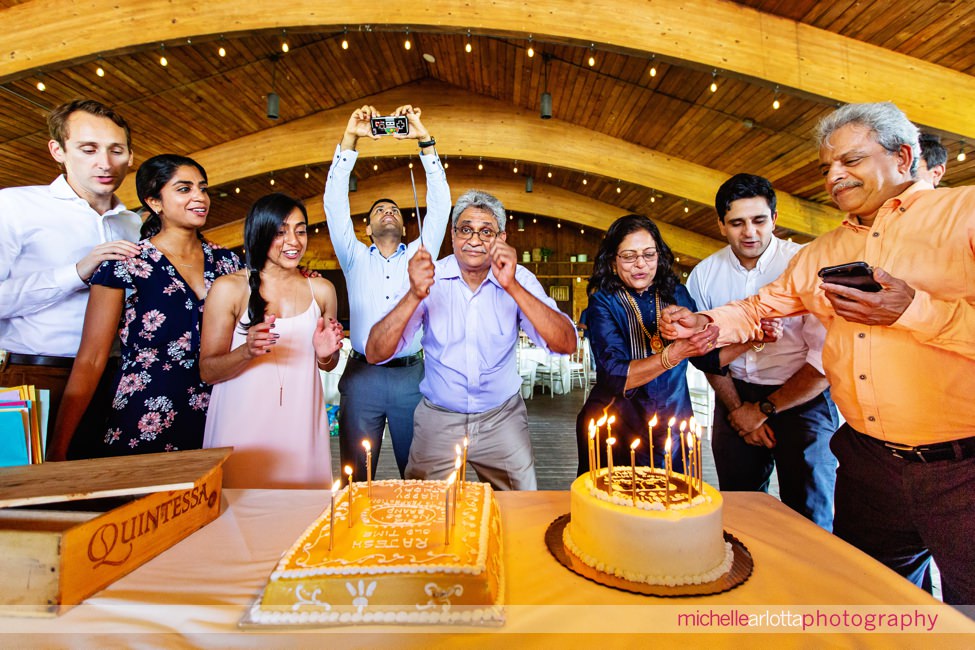 Rajesh gets ready to cut his cake at hissurprise 60th birthday party at sweetgrass pavilion
