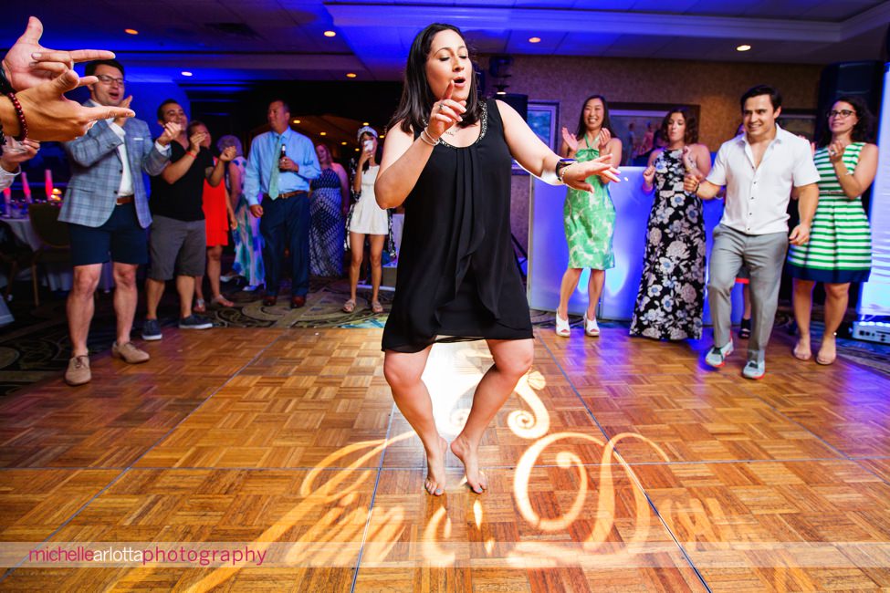 wedding guests having fun during same sex wedding couple's New Jersey shore grand hotel cape may wedding with dj bobby lafauci of sce events