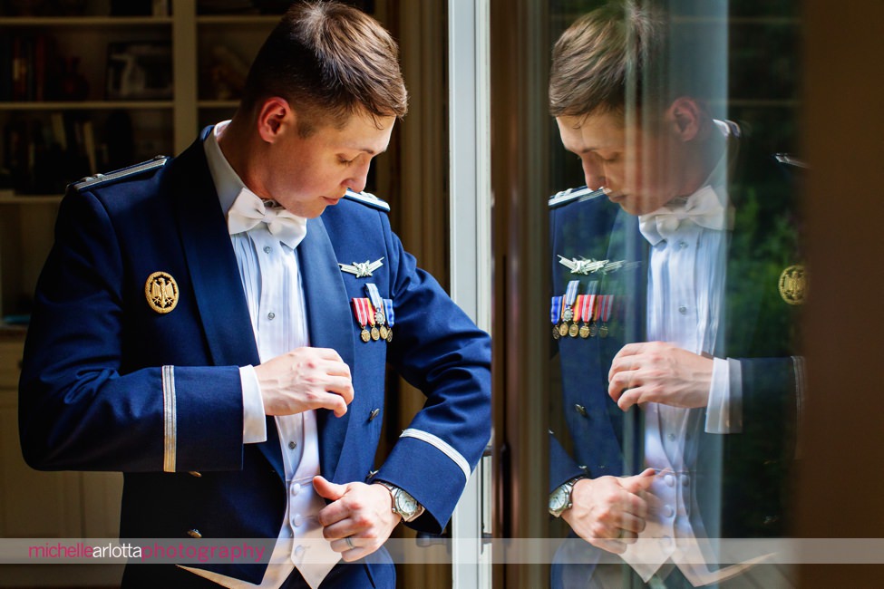 Air Force groom does final checks on his wedding day attire in New Jersey