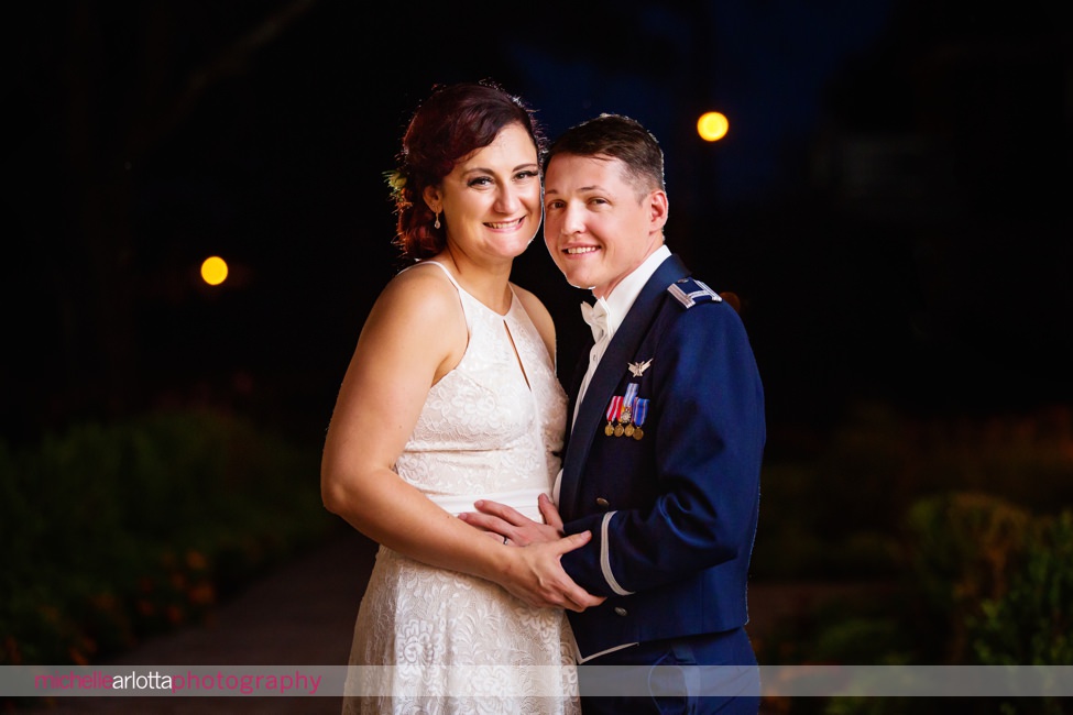 bride in sleeveless short wedding gown and groom in Air Force uniform night portrait at ryland inn