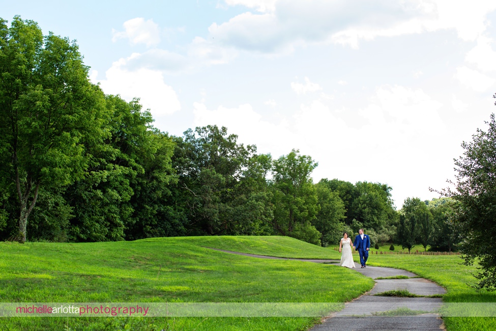 bride in pronovias dress groom in blue suit portrait at New Jersey bear brook valley wedding